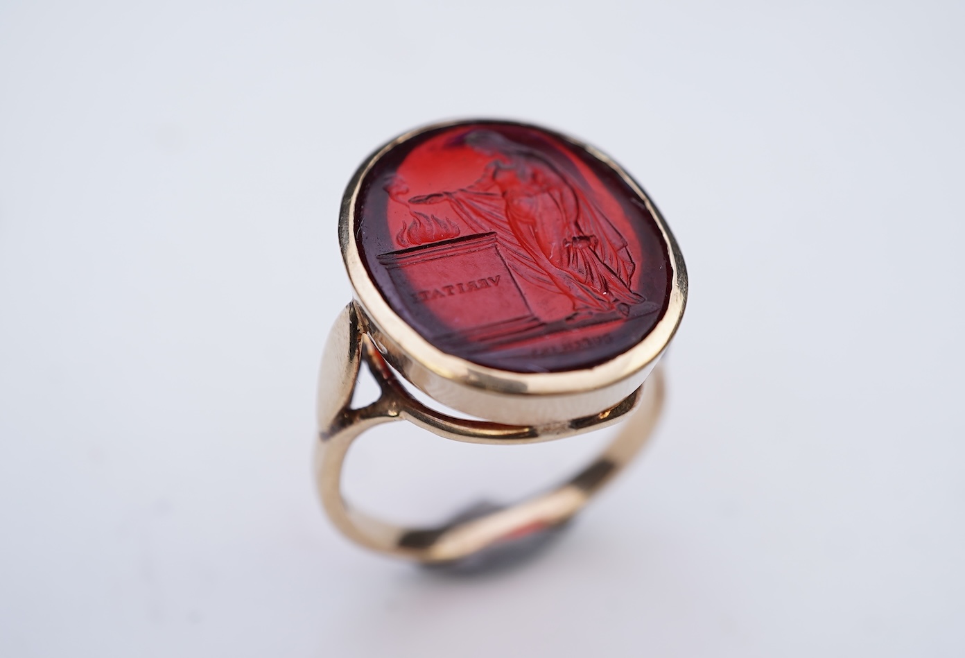 A glass intaglio ring, early 20th century